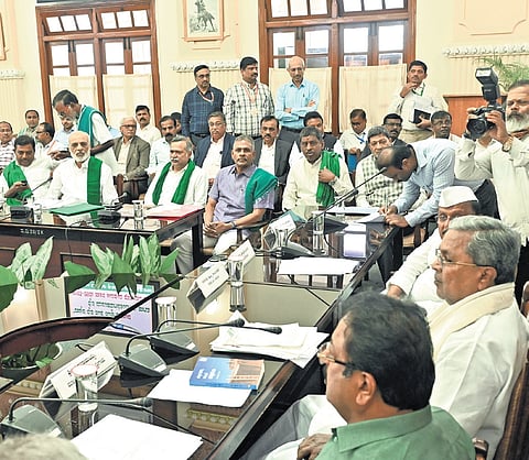 CM Siddaramaiah meets farmer leaders to seek their suggestions before the budget, at Vidhana Soudha on Monday.
