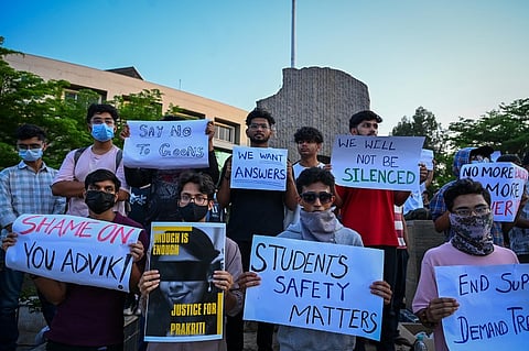 Students sit on silent protest outside KIIT University campus demanding justice for the girl who allegedly committed sucide