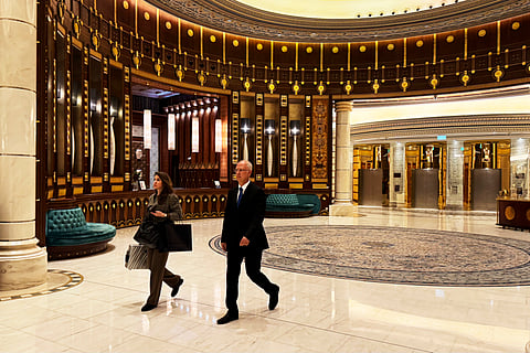 Kirill Dmitriev, the head of the Russian Direct Investment Fund, right, and Maria Medvedeva, the deputy CEO for external communication for the fund, walk across the Ritz Carlton hotel in Riyadh, Saudi Arabia, Tuesday, Feb. 18, 2025.