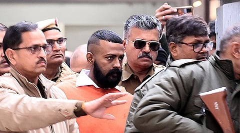 Sukesh Chandrashekhar leaves Patiala House Court in Delhi.