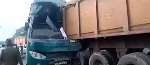 The bus which has collided with the stationary truck