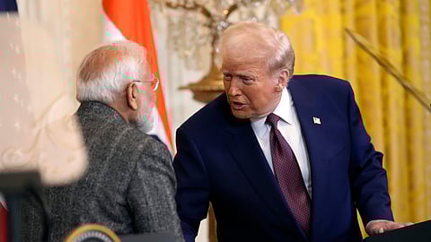 US President Donald Trump, right, speaks with Prime Minister Narendra Modi during a news conference in the East Room of the White House, Thursday, Feb. 13, 2025, in Washington.