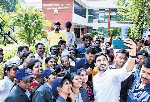 Lokesh taking a selfie with students during his visit to Sri Padmavati Women’s University on Wednesday