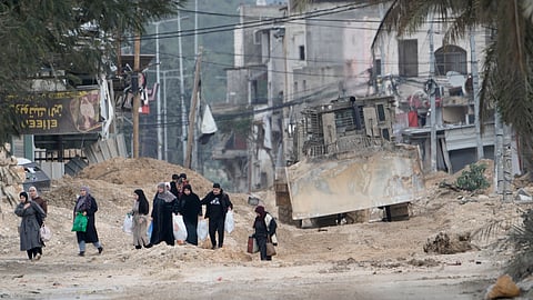 Residents of the West Bank refugee camp of Nur Shams, near Tulkarem, evacuate their homes as the Israeli military continues its 'operation' in the area on Tuesday, Feb. 11, 2025.