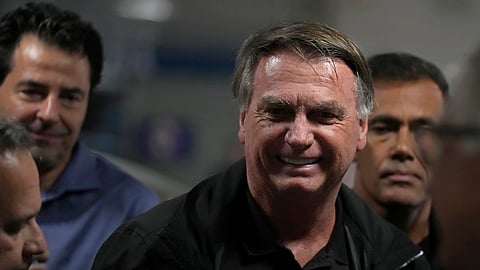Former Brazilian President Jair Bolsonaro arrives for a luncheon with senators from his support base, at the National Congress building in Brasilia, Brazil, Tuesday, Feb. 18, 2025.