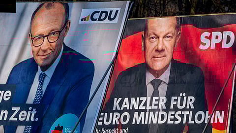 Election posters showing German Chancellor Olaf Scholz, right, and CDU top candidate for chancellor Friedrich Merz in Frankfurt, Germany, Feb. 8, 2025.