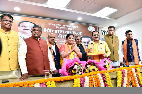 BJP MLA Rekha Gupta greets after being named as the new CM of Delhi by the party during the party legislative meeting, in New Delhi on Wednesday.