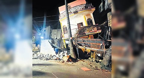 The building tilted after its lower portion partially collapsed on Wednesday