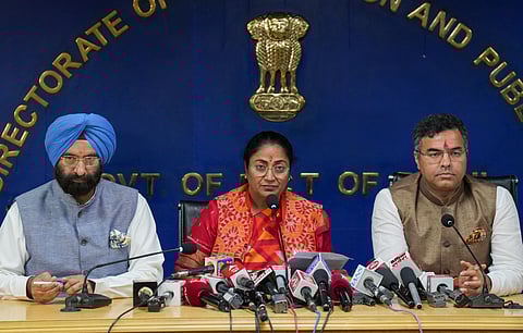 Delhi Chief Minister Rekha Gupta, center, addresses her first press conference as the CM with cabinet ministers Manjinder Singh Sirsa, left, and Parvesh Verma, after the cabinet meeting of the new government at the Delhi Secretariat, in New Delhi, Thursday, Feb. 20, 2025.