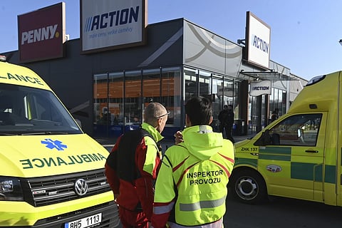Police and ambulances are seen in a shopping area in Hradec Kralove, Czech Republic, where two women died after a knife attack, Thursday, Feb 20, 2025.