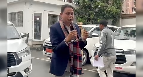 Congress leader Bhuvan Kapdi arriving at the assembly complex handcuffed and shackled.