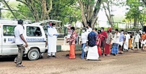 Asraya distributing food packets to the patients and their families