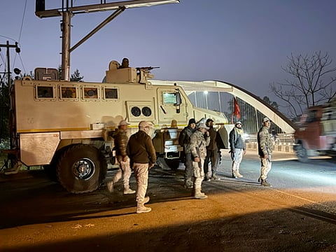 Security personnel stand guard following imposition of President's rule in the state, in Imphal East, Manipur, Thursday, Feb. 13, 2025