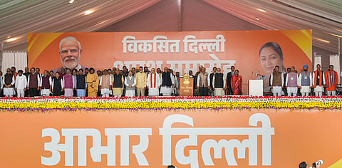 Prime Minister Narendra Modi and other dignitaries with newly sworn-in Delhi Chief Minister Rekha Gupta and ministers during the oath ceremony at Ramlila Maidan, in New Delhi, Thursday, Feb. 20, 2025.