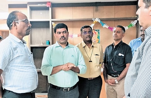 Commissioner of Stamps (left) KV Dayananda listens to the grievances of
sub-registrars at his office in Bengaluru on Friday