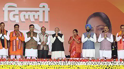 Prime Minister Narendra Modi and LG VK Saxena with newly sworn-in Delhi Chief Minister Rekha Gupta and ministers during the oath ceremony at Ramlila Maidan, in New Delhi.