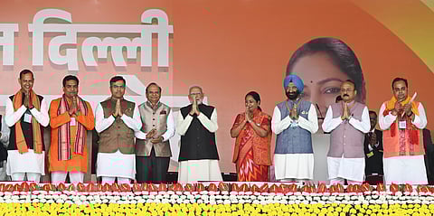 Prime Minister Narendra Modi and LG VK Saxena with newly sworn-in Delhi Chief Minister Rekha Gupta and ministers during the oath ceremony at Ramlila Maidan, in New Delhi, Thursday, Feb. 20, 2025.