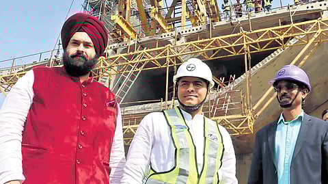 Minister Parvesh Verma inspects Barapullah elevated road project that connects Mayur Vihar to Sarai Kale Khan on Saturday.