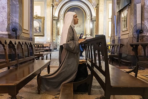 Missionary nun Maria Engracia, from Mexico, prays for the health of Pope Francis at the Metropolitan Cathedral in Buenos Aires, Argentina on Friday, Feb 21, 2025.