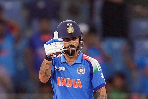 India's Virat Kohli celebrates his half century during a (ODI cricket match of the ICC Champions Trophy between India and Pakistan, at Dubai International Cricket Stadium, in Dubai, UAE, Sunday, Feb. 23, 2025