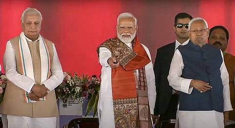 Prime Minister Narendra Modi with Bihar Governor Arif Mohammed Khan and Chief Minister Nitish Kumar during the launch of various development projects, in Bhagalpur, Bihar.