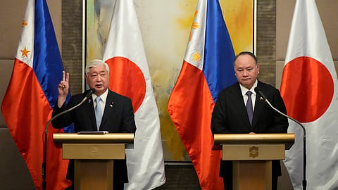Japanese Defense Minister Gen Nakatani, left, gestures beside Philippine Defense Secretary Gilberto Teodoro during their press conference in Makati city, Philippines on Monday, Feb. 24, 2025.