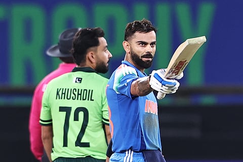 India's Virat Kohli celebrates after scoring a century and his team's win at the end of the ICC Champions Trophy ODI cricket match between Pakistan and India at the Dubai International Stadium in Dubai on February 23, 2025.