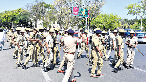 Police personnel keep vigil and maintain tight security, after parties planned protest rallies in Mysuru on Monday