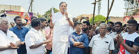SIWU chief E Muthukumar and other workers protesting in Sriperumbudur