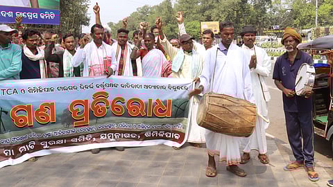 Members of the Munda tribe stage mass protest against eviction from their lands at Master Canteen in Bhubaneswar on Monday.