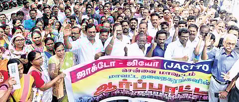 Government school teachers and employees staging a demonstration demanding the reinstatement of the old pension scheme at the Ezhilagam in Chepauk, Chennai on Tuesday