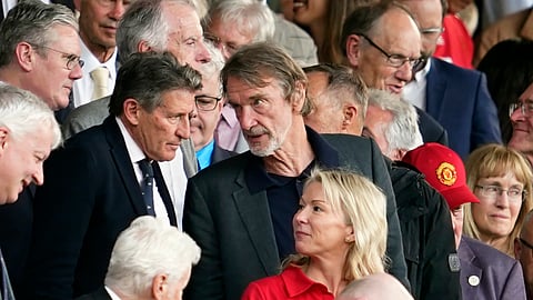 Jim Ratcliffe, center, in the stands during the English Premier League soccer match between Manchester United and Arsenal at the Old Trafford Stadium in Manchester, England, Sunday, May 12, 2024.