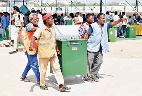 Election staff shift
poll material from the Ambedkar Stadium in Karimnagar