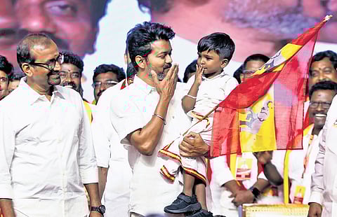 Vijay carrying a child, Ilam Siddharth from Madurai, in his arm | Ashwin prasath