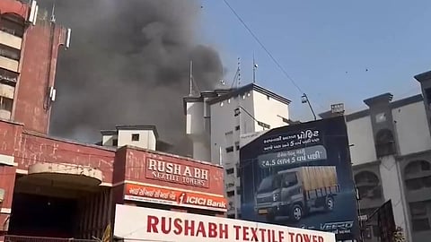 A fire broke out again in Surat's Shiv Shakti Textile Market, spreading to multiple shops.