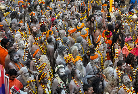 Naga sadhus take out a procession towards the Kashi Vishwanath temple to offer prayers on the occasion of Maha Shivratri.