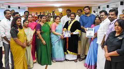 Mayor Mu Anbalagan releasing the street dog survey report ahead of the corporation council meeting in Tiruchy on Wednesday.
