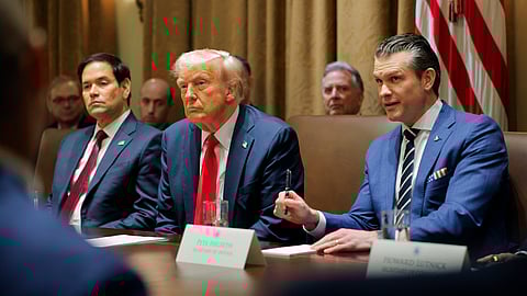 US President Donald Trump (C) listens during a Cabinet meeting at the White House in Washington, Tuesday, Feb. 26, 2025, as Secretary of State Marco Rubio (L) and Defense Secretary Pete Hegseth (R) listen.