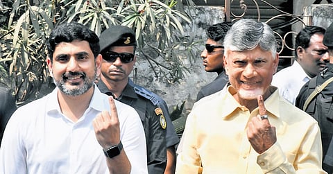 Chief Minister N Chandrababu Naidu and HRD Minister Nara Lokesh show their ink-marked fingers after casting their votes in the MLC election at Undavalli in Guntur district on Thursday