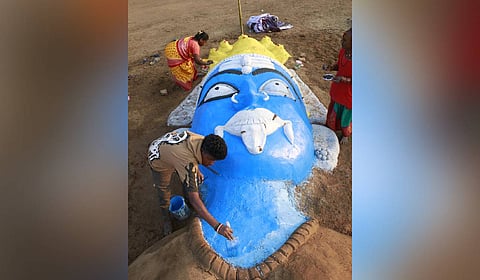 People paint sculptures of goddess Kali made at the graveyard near new bus stand ahead of Mayana Kollai festival on Thursday.