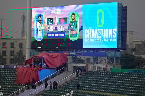 Fans leave the enclosure due to rain before start of the ICC Champions Trophy cricket match between Pakistan and Bangladesh, in Rawalpindi, Pakistan, Thursday, Feb. 27, 2025.