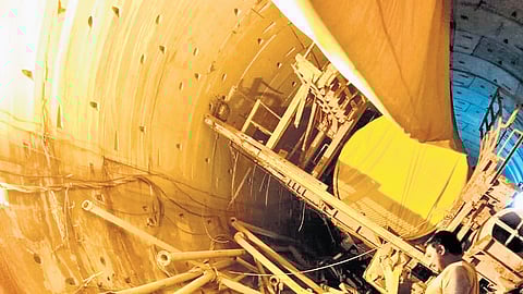 Rescue teams use gas cutters to cut the debris of the TBM so that the pieces can be taken out of the SLBC tunnel on Thursday