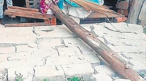 The collapsed wall of a house in Eturunagaram due to an earthquake