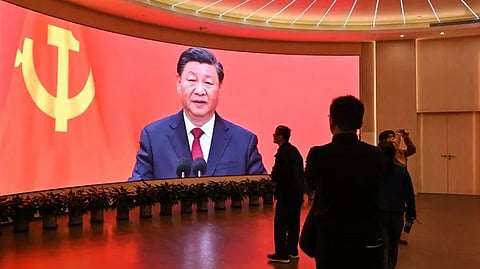 A screen shows images of China's President Xi Jinping as people visit the Museum of the First National Congress of the Chinese Communist Party in Shanghai on February 27, 2025, ahead of the opening of the annual session of the National People’s Congress in March.