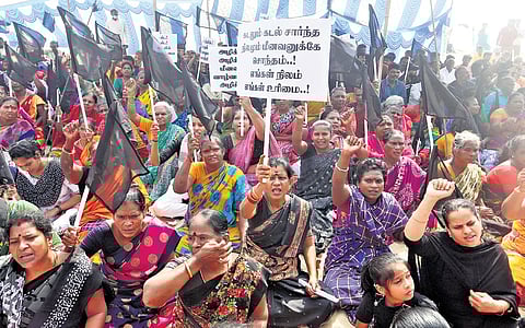 Fisherfolk staging a protest in Srinivasapuram on Friday.