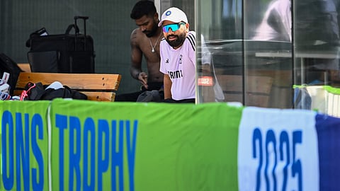 India's captain Rohit Sharma (R) during a practice session at the ICC Academy ground in Dubai