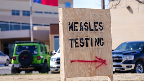 A sign is seen outside of Seminole Hospital District offering measles testing, Feb. 21, 2025, in Seminole, Texas.