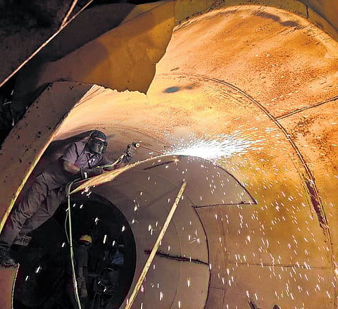 Rescue teams use gas cutters to cut through the massive tunnel boring machine as they work tirelessly to reach the eight workers trapped in the SLBC tunnel for the past eight days, on Saturday.