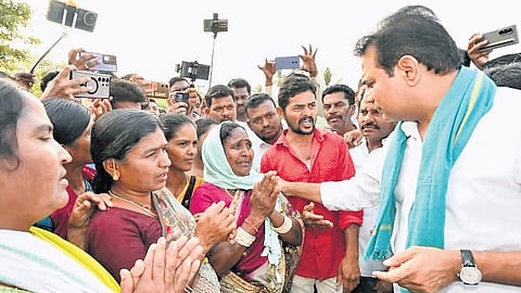 BRS working president KT Rama Rao interacts with residents of Sircilla on Sunday.