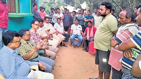 Health officials in discussion with the locals on Saturday.